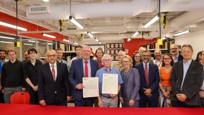Professor and Dept. Head Alhussein Abouzeid, President Martin Schmidt ’81, Doug Mercer ’77, Provost Rebecca Doerge, Dean Shekhar Garde (L-R Front Row) at the Signing Ceremony on August 25 